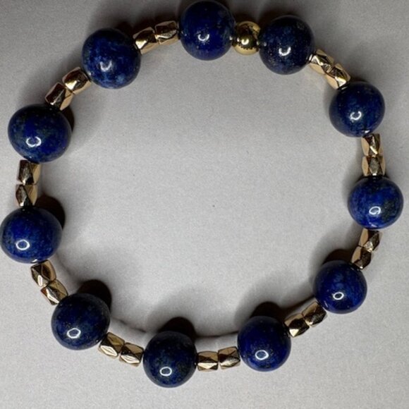 bracelet features polished deep navy-blue gemstone beads - Picture 2 of 3
